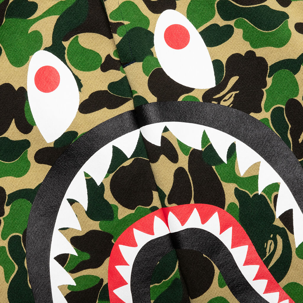 http://feature.com/cdn/shop/products/A-Bathing-Ape-Abc-Camo-Side-Shark-Sweat-Shorts---Green-001SPJ301016M-GRN-04-20-23-Feature-DV-5.jpg?v=1682035443