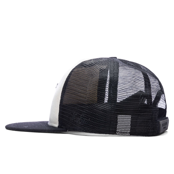 https://feature.com/cdn/shop/products/Fear-Of-God-Essentials-Cream-Wool-Trucker---Black-Cream-60351345-03-31-23-Feature-KN-6_grande.jpg?v=1680537368